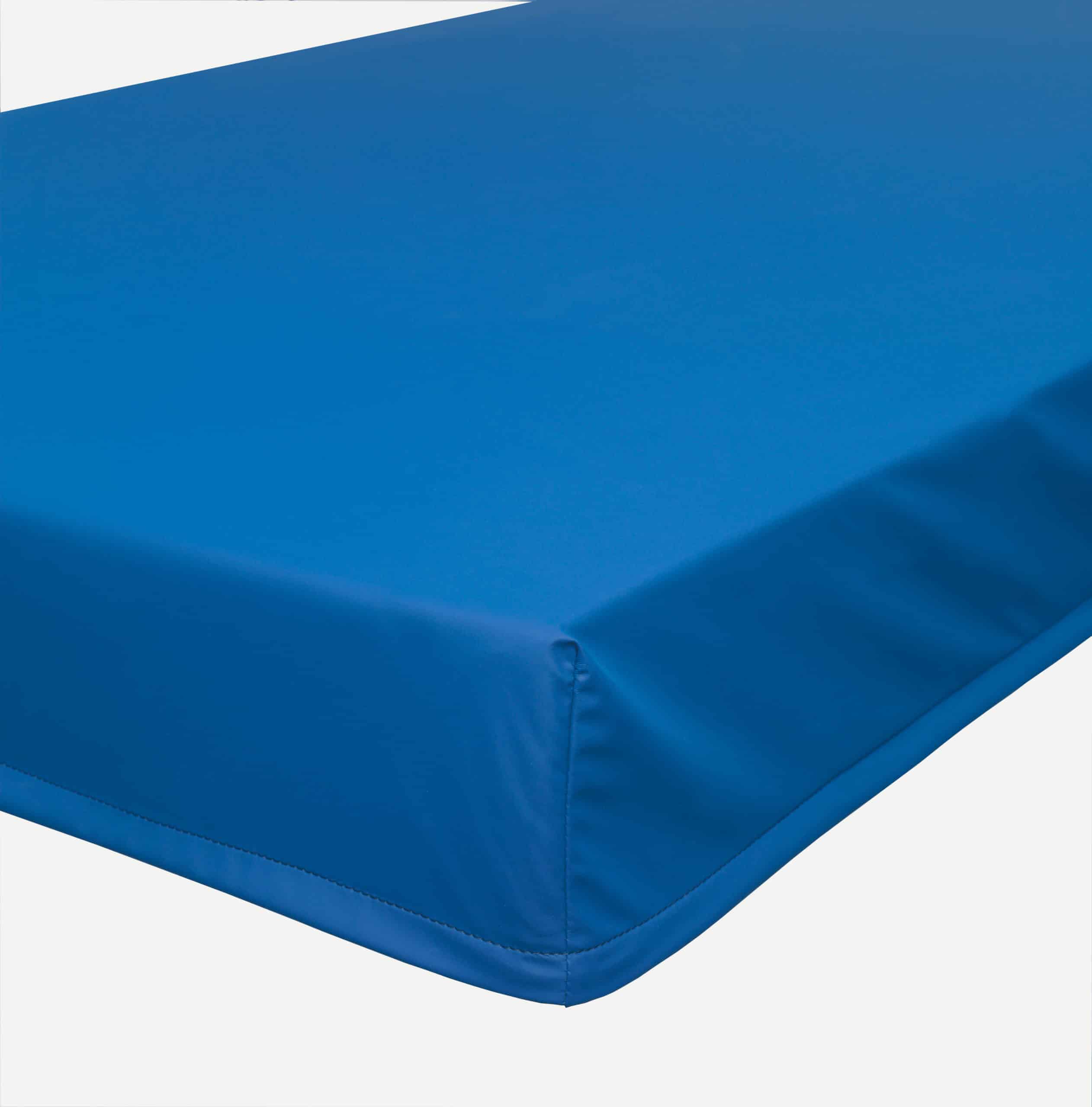 a close up of a blue mattress on a white background.