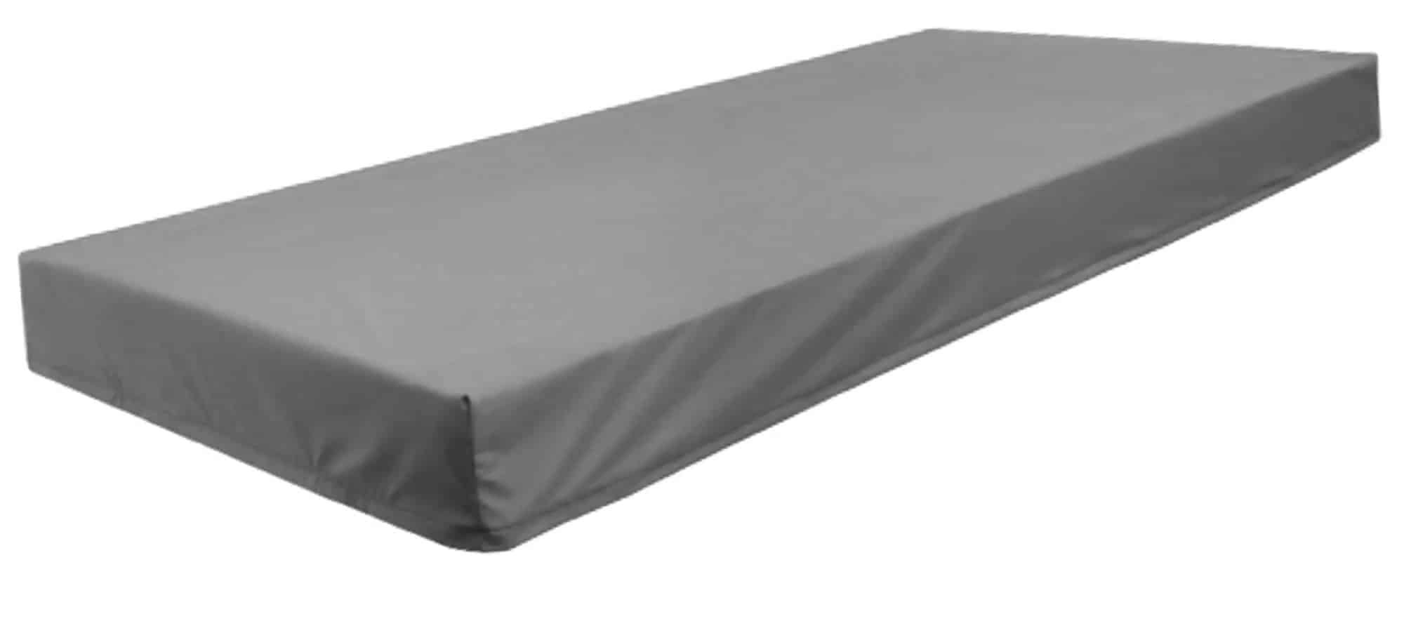 a gray sheet that is on top of a bed.