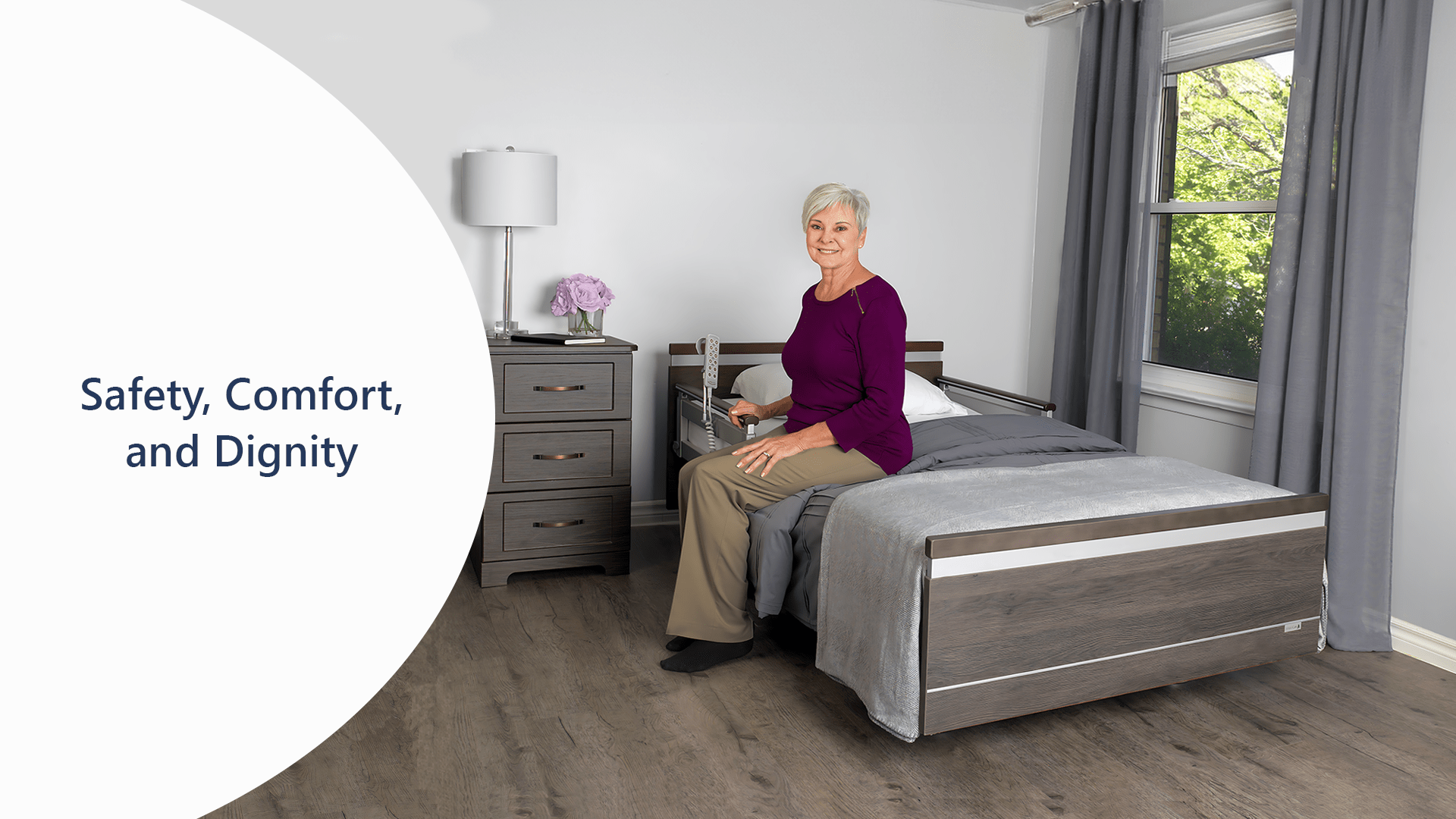 A woman sitting on a bed at home, finding safety and comfort while maintaining her dignity.