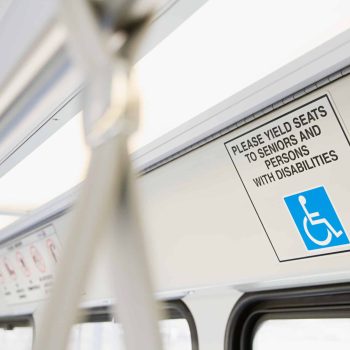 a sign on the side of a subway car. a sign on the side of a subway car.