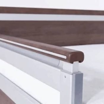 a close up of a bed with a wooden headboard. a close up of a bed with a wooden headboard.