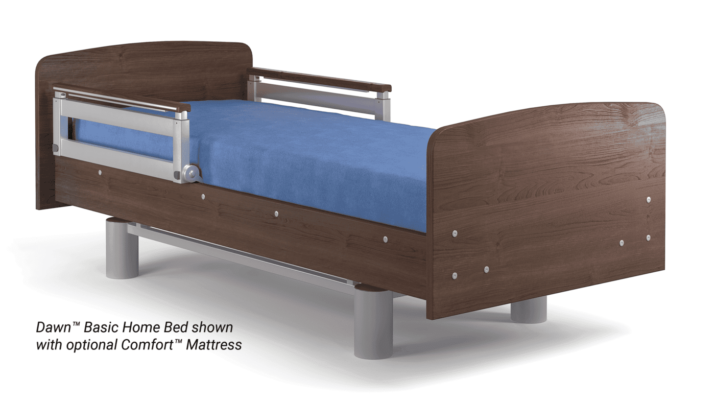 Hospital bed with wooden headboard and footboard, metal side rails, and a blue mattress. The image contains text that reads: “Dawn™ Basic Home Bed shown with optional Comfort™ Mattress.” This hospital bed setup is perfect for any home in the USA's bustling city life.