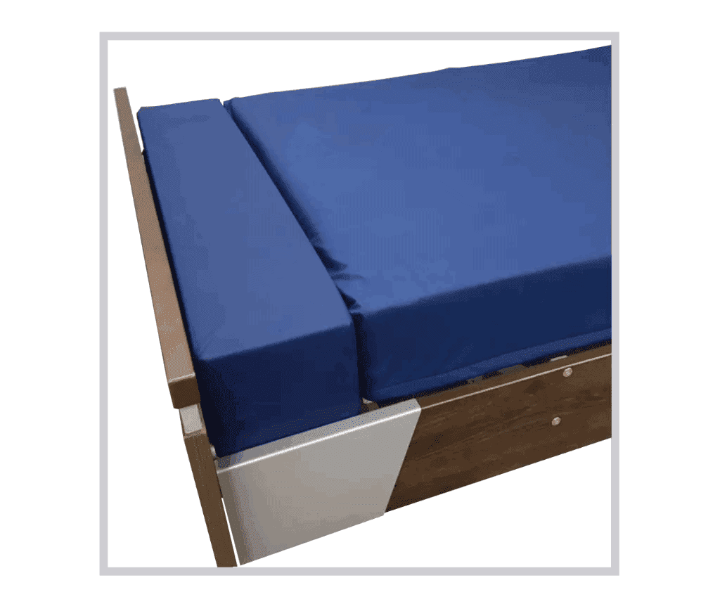 a close up of a bed with blue sheets.