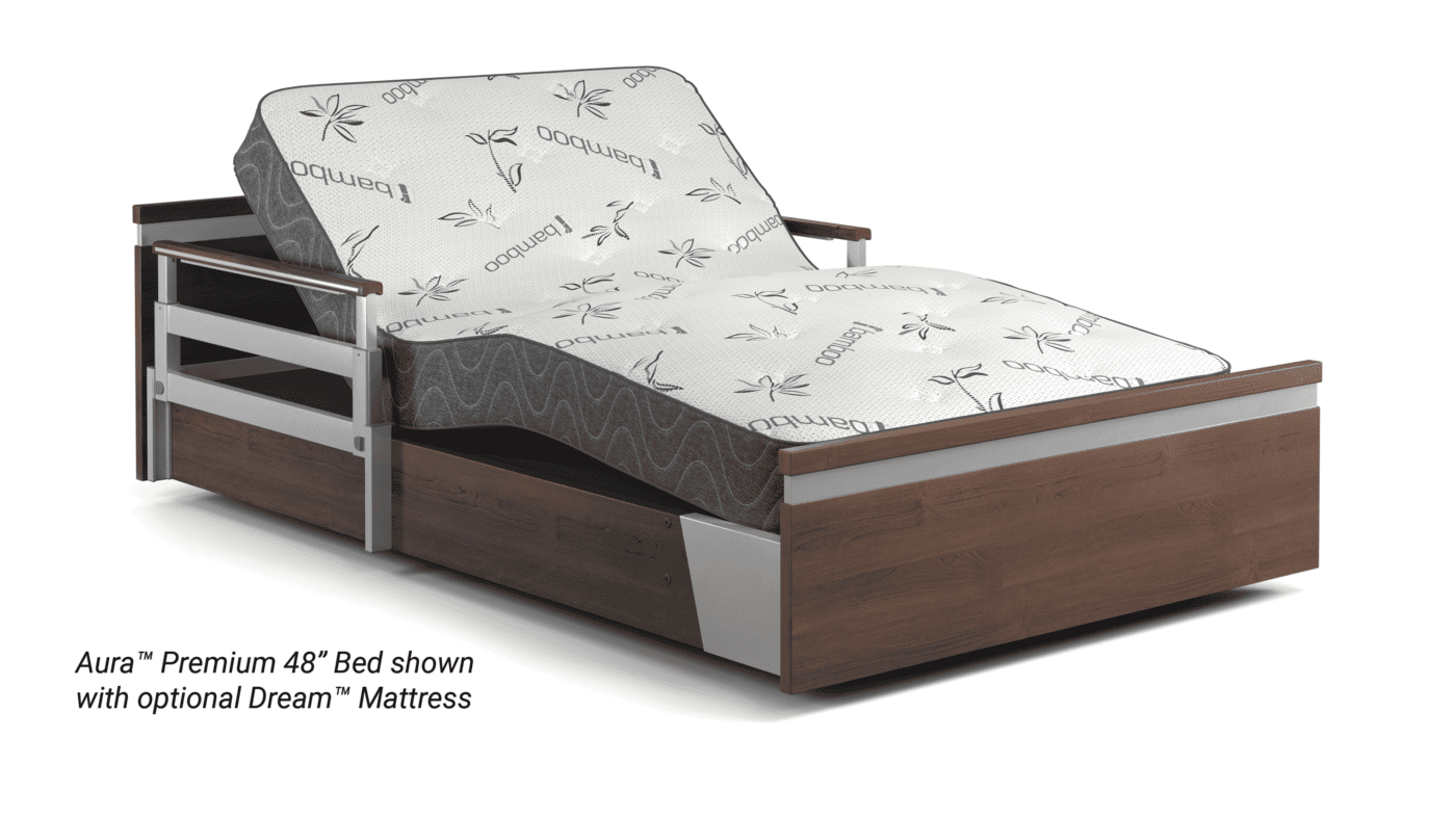 Adjustable bed with wooden and metal frame, tilted head section, and a mattress labeled with "Dream" and plant designs. Text reads: "Aura™ Premium 48’’ Bed shown with optional Dream™ Mattress, perfect for hospitals across the USA.