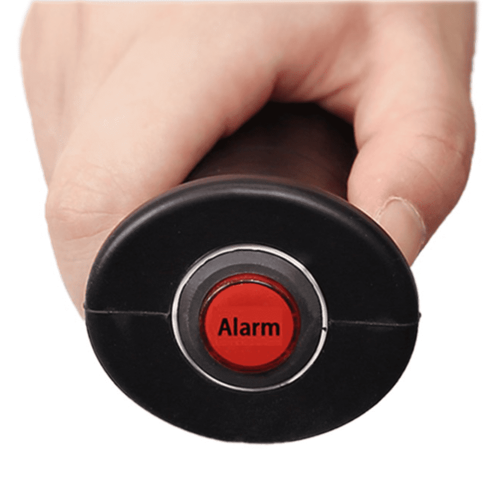 a hand holding a red button with the word alarm on it.