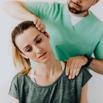 a man helping a woman with her hair.