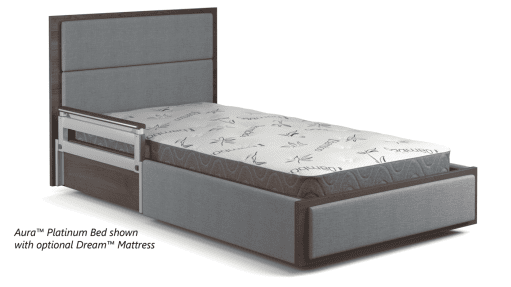 A single Aura Platinum Bed with an optional Dream Mattress, perfect for any city apartment. The bed features a modern wooden frame and upholstery. The mattress is white with a minimalist pattern. The bed includes a headboard and footboard, offering superior comfort reminiscent of the best hospitals in the USA.